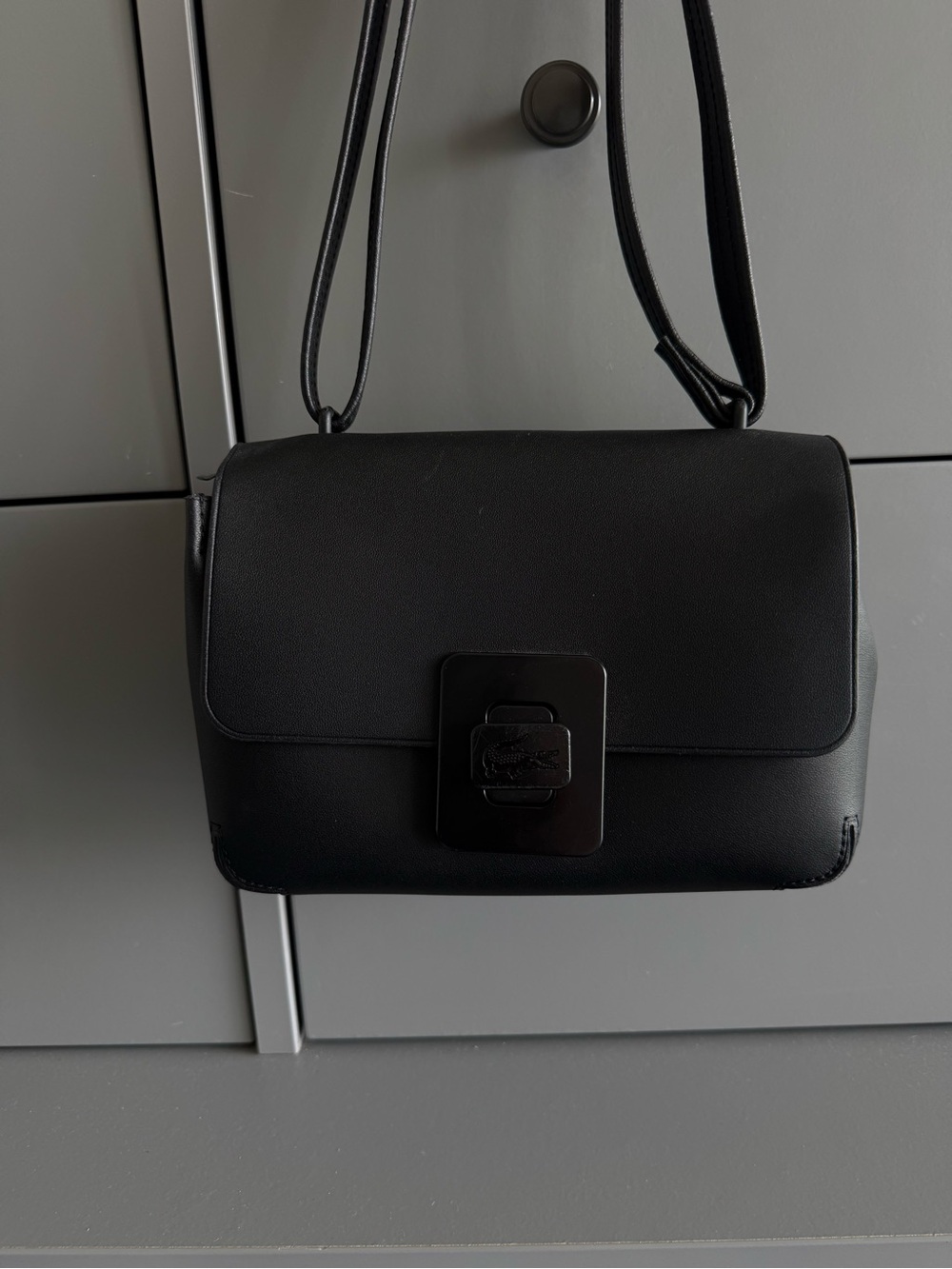 Lacoste Black Leather Crossbody Bag with Signature Clasp
